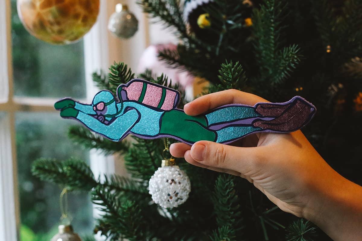 Àine & Co. Ark Bookmark in Scuba, featuring green, pink and teal scuba diver design