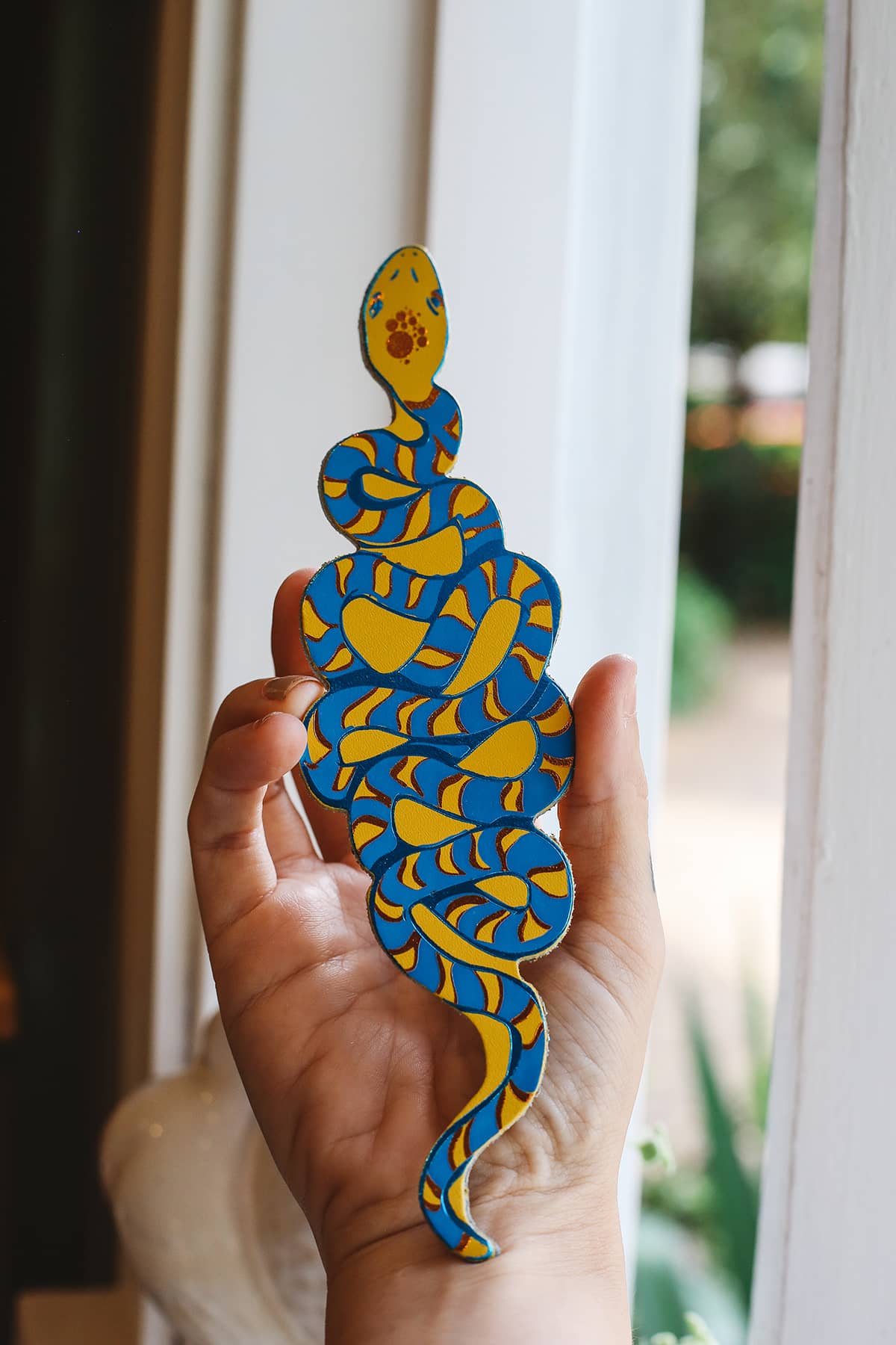 Àine & Co. Ark Bookmark in snake, featuring illustrated blue and yellow snake design