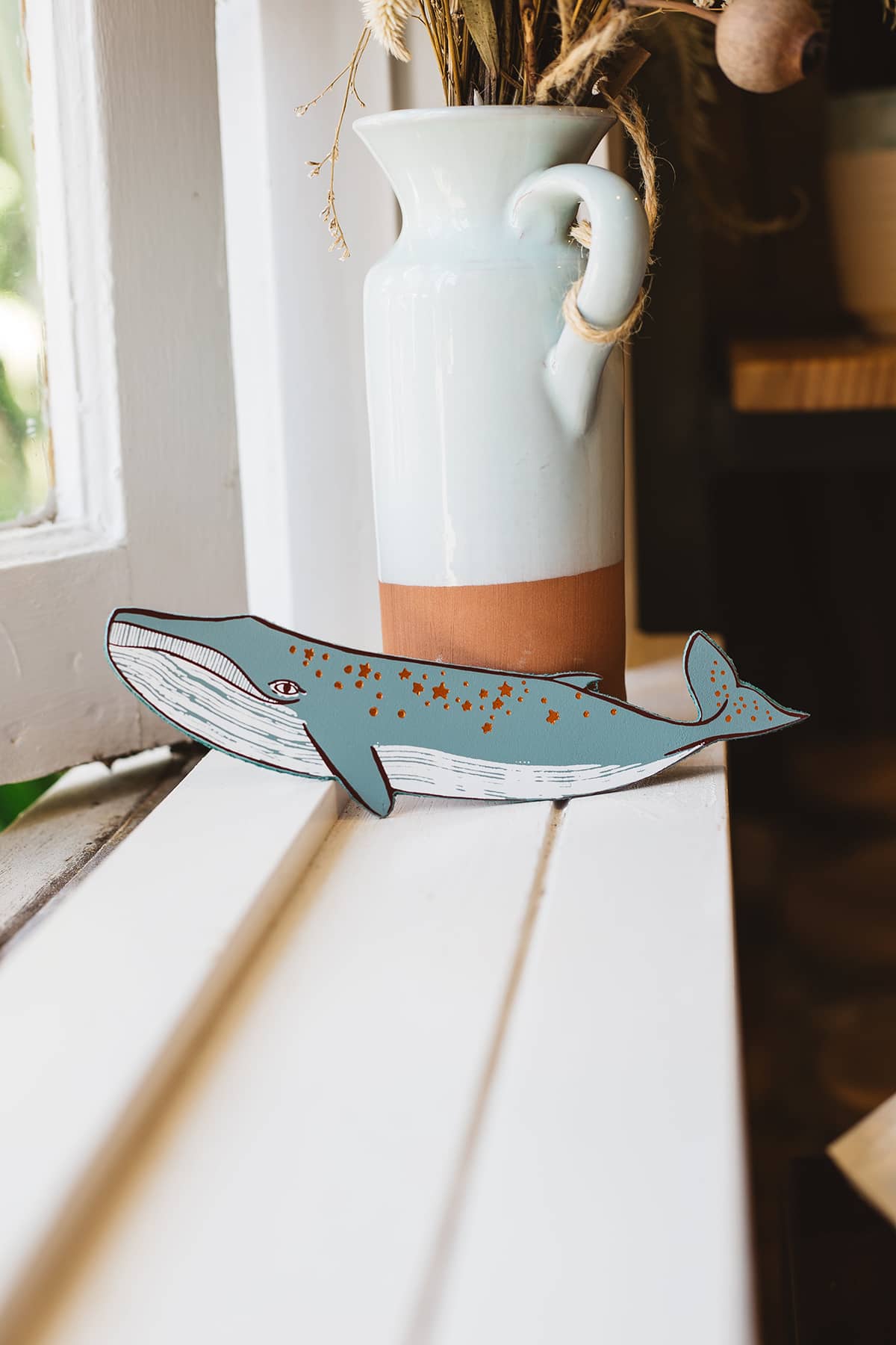 Àine & Co. Ark Bookmark in whale design with dark orange stars along back and tail