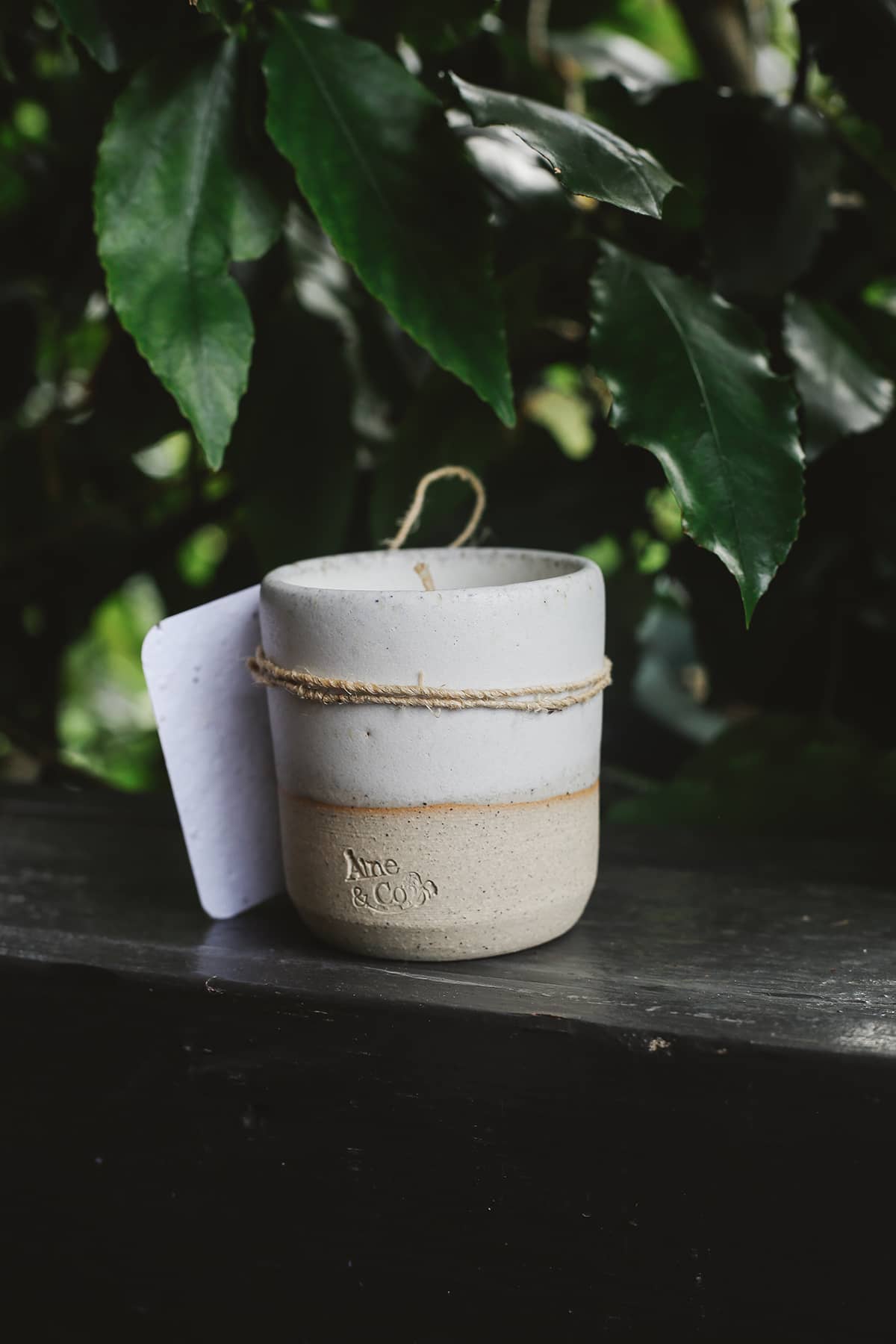Àine & Co. Ceramic Tumbler Candle in white, featuring cylindrical ceramic cup with natural speckled white on the bottom half and white glaze on the top half