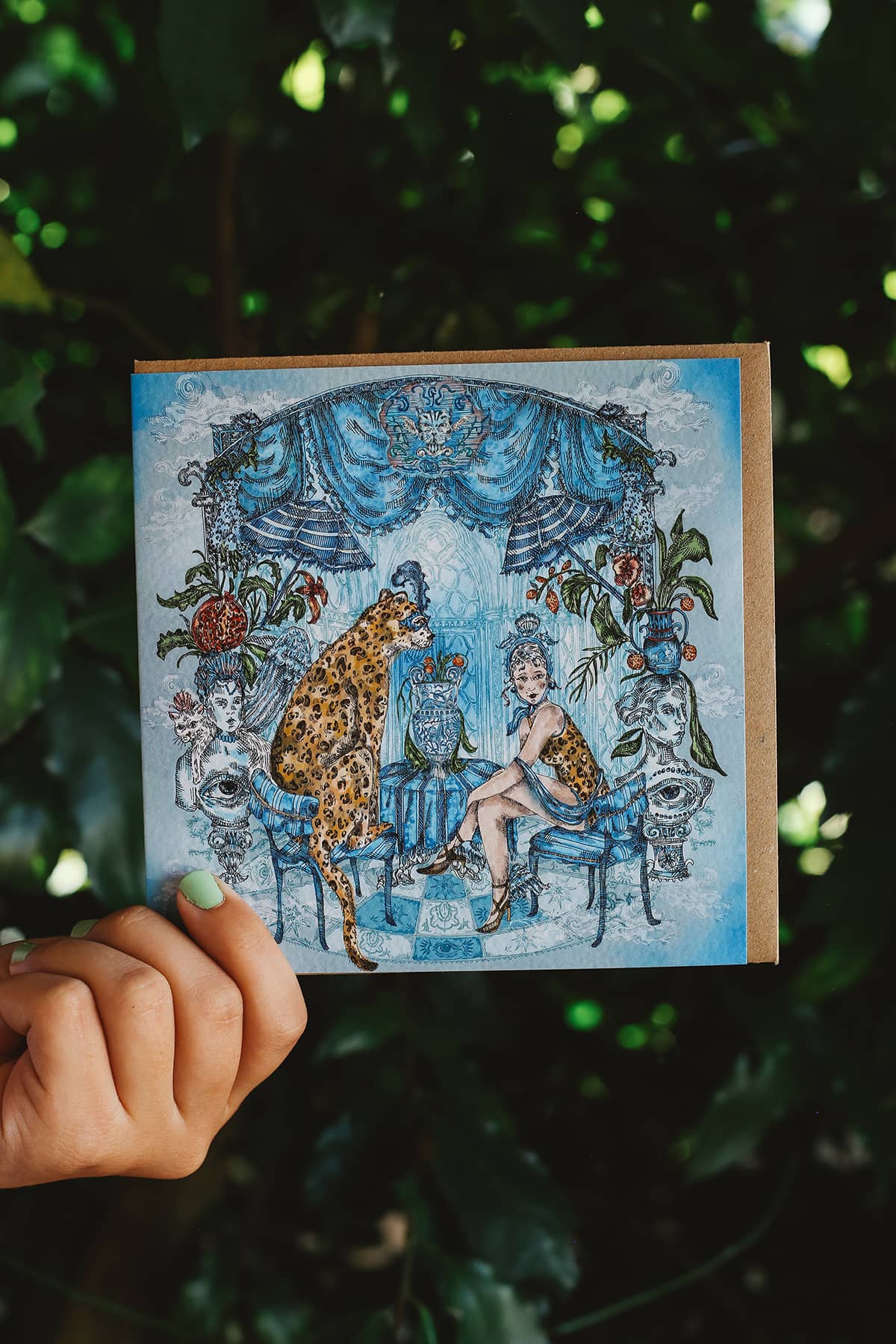 Gisela Greeting Card in "Leopard Lady" featuring an intricate illustration of a leopard and a lady sitting together in a decorated blue room