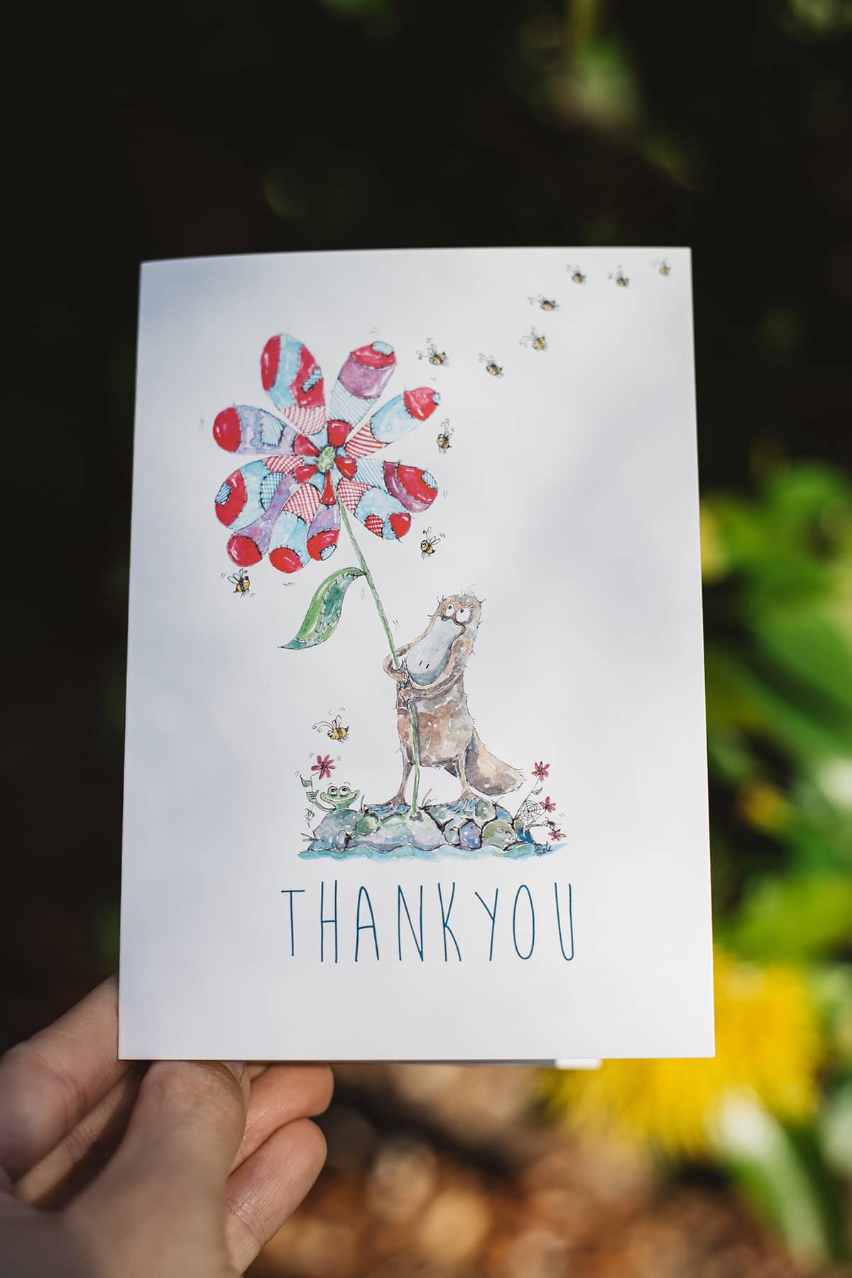 Àine & Co. gift card by Australian Artist, Heather Dale, featuring an illustrated platypus holding patchwork flower with text "Thank you"