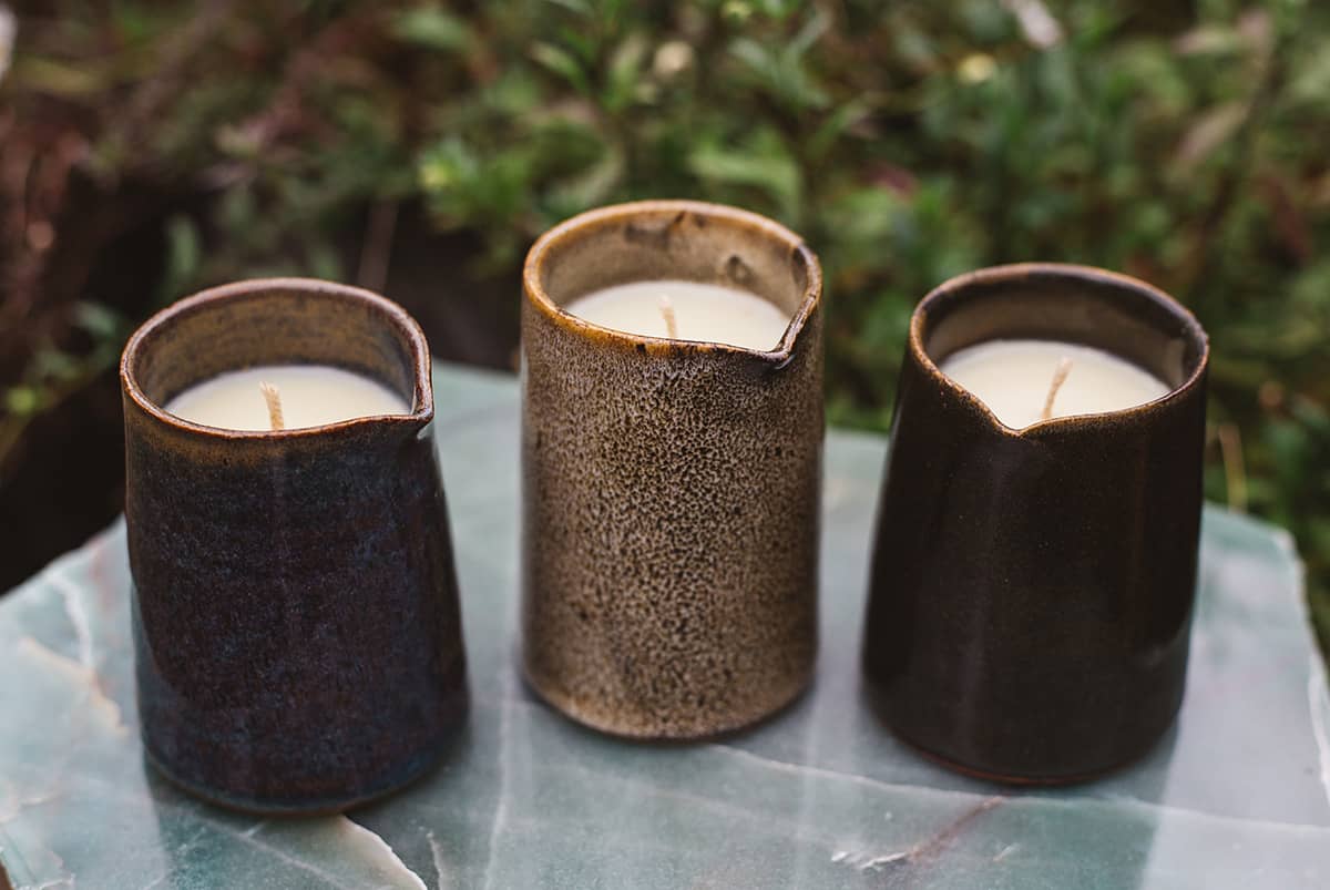 Three of Àine & Co. Beard and Face Balm Candle with cotton wick in ceramic milk jug