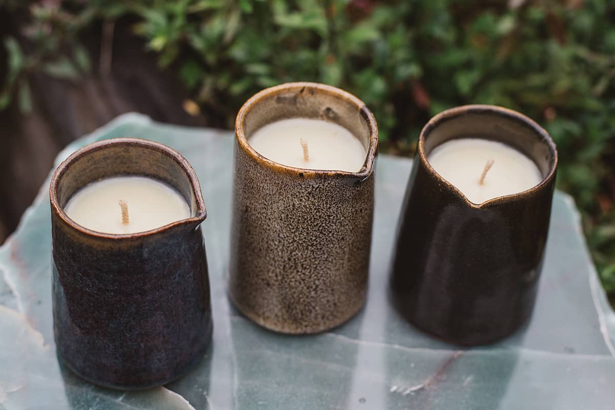 Three of Àine & Co. Beard and Face Balm Candle with cotton wick in ceramic milk jug