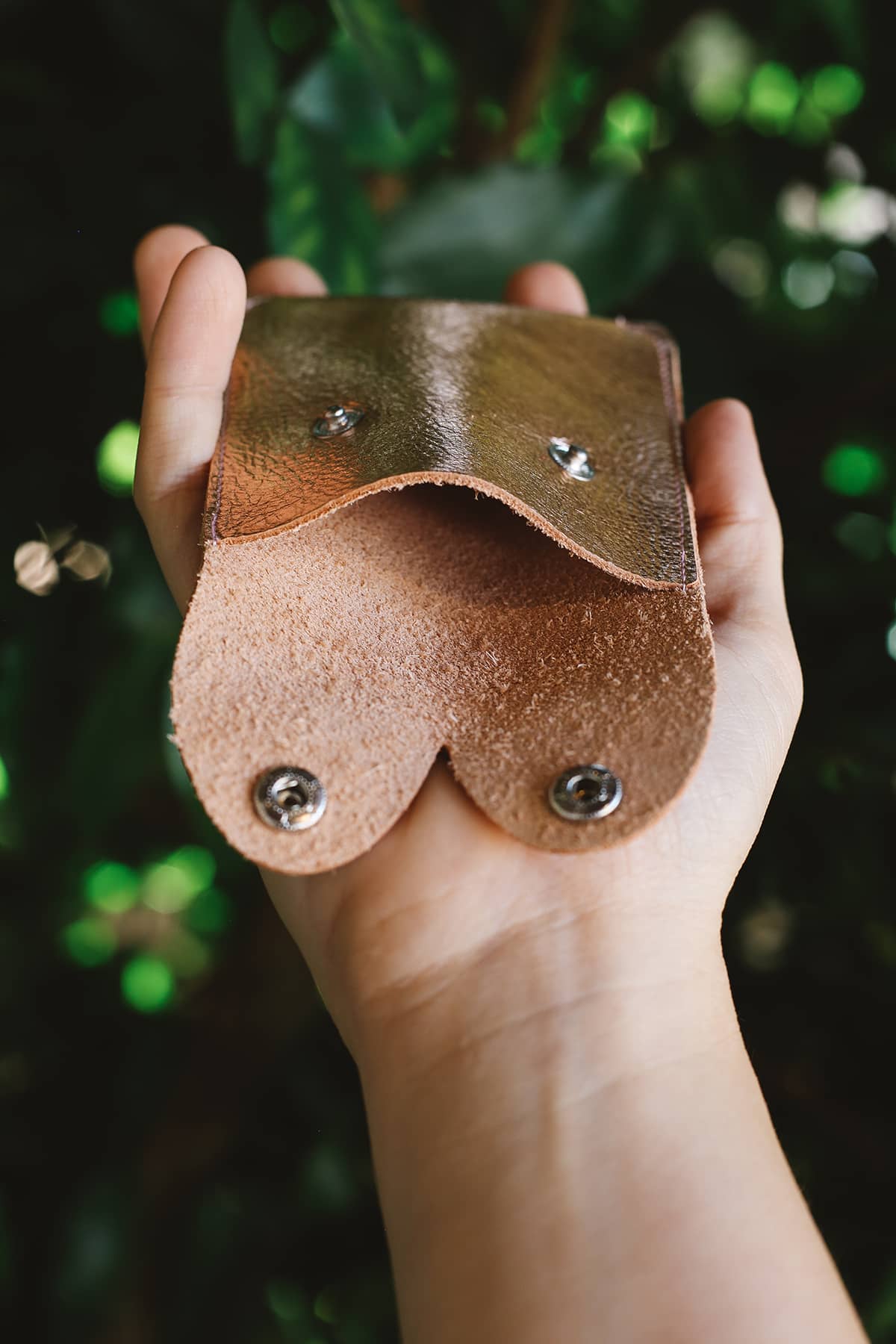 Interior of Àine & Co. Alkemest Boobie Coin Purses in Gold featuring metallic gold leather with snap button closure
