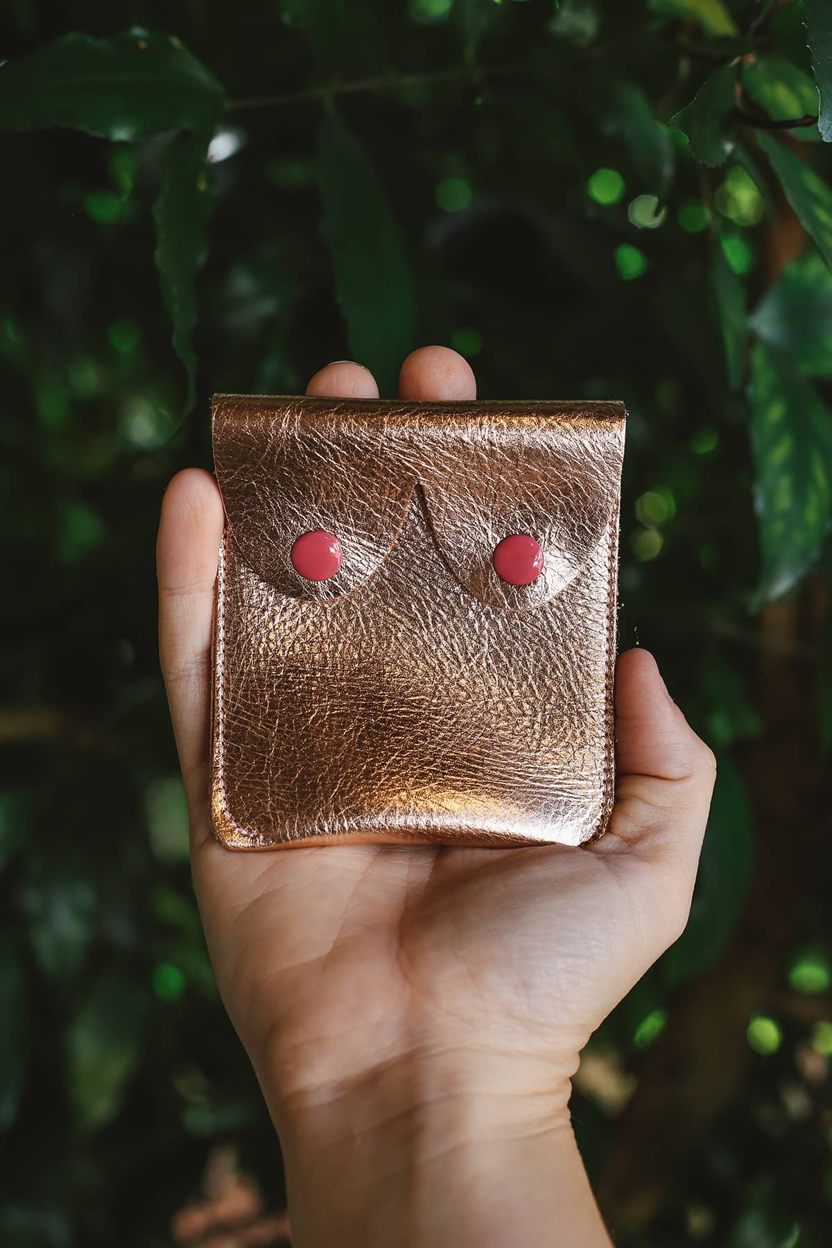 Àine & Co. Alkemest Boobie Coin Purses in Gold featuring metallic gold leather with red snap button closure