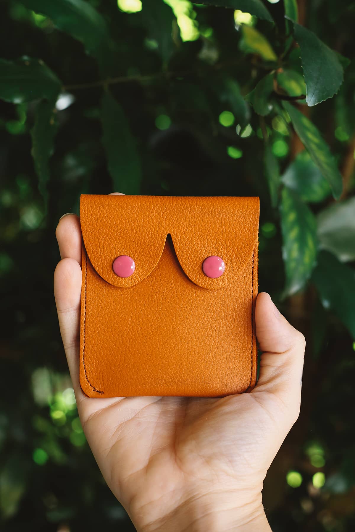 Àine & Co. Alkemest Boobie Coin Purses in Orange (Tan) featuring orange leather with pink snap button closure