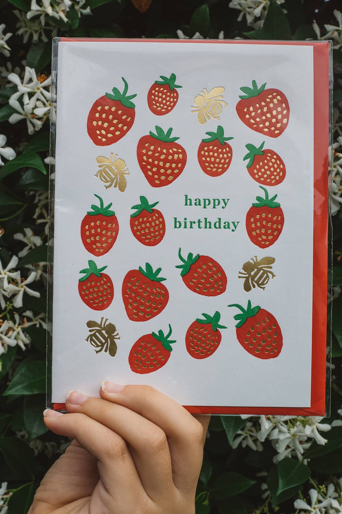Àine & Co. Archivist greeting card featuring red strawberries and gold bees with text "happy birthday"