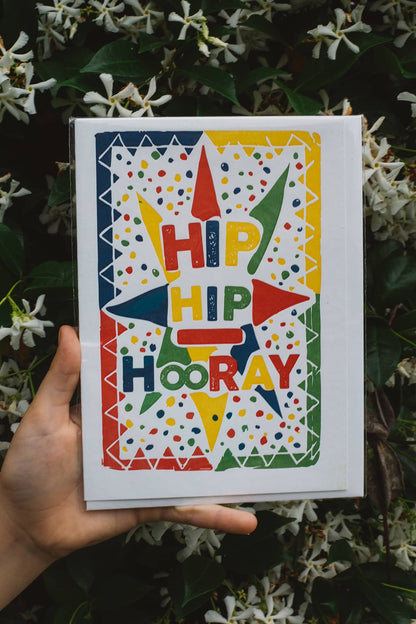 Àine & Co. Archivist greeting card featuring festive pattern background and multicoloured text "Hip Hip Hooray"