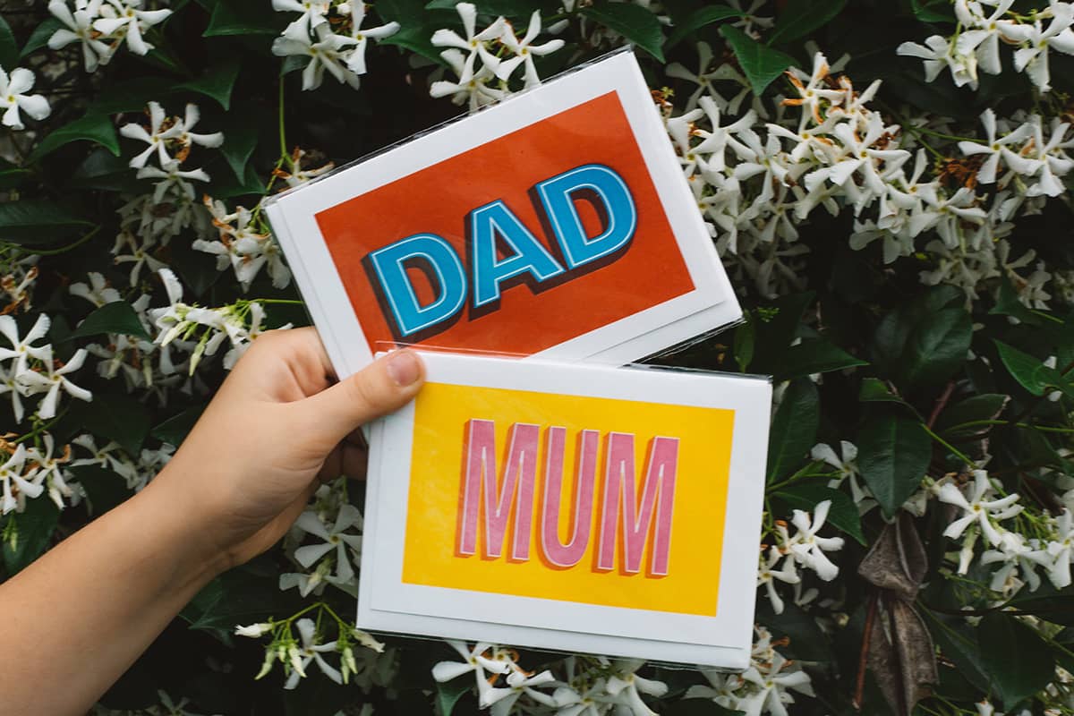 Àine & Co. Archivist greeting card featuring bold text "MUM" and "DAD"