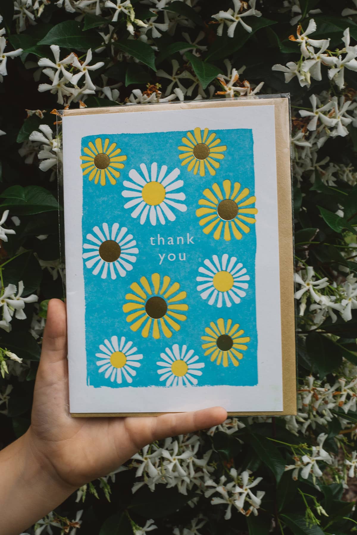 Àine & Co. Archivist greeting card featuring simple sunflower pattern and text "thank you" on turquoise background