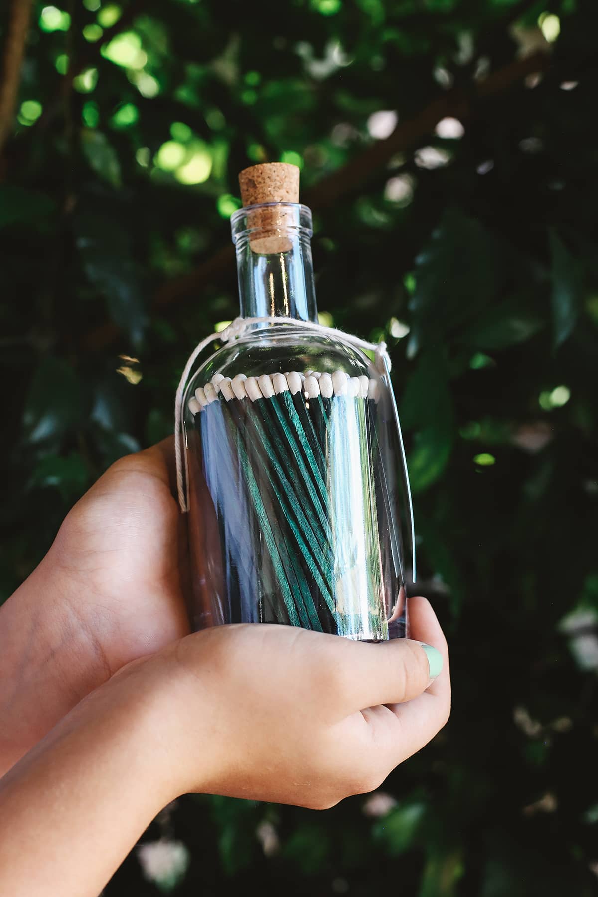 Archivist Match Bottle featuring long green matches in a corked glass bottle 