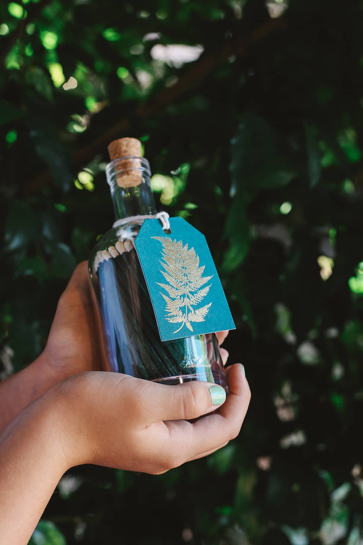 Archivist Match Bottle featuring long green matches in a corked glass bottle with a festive green gift tag