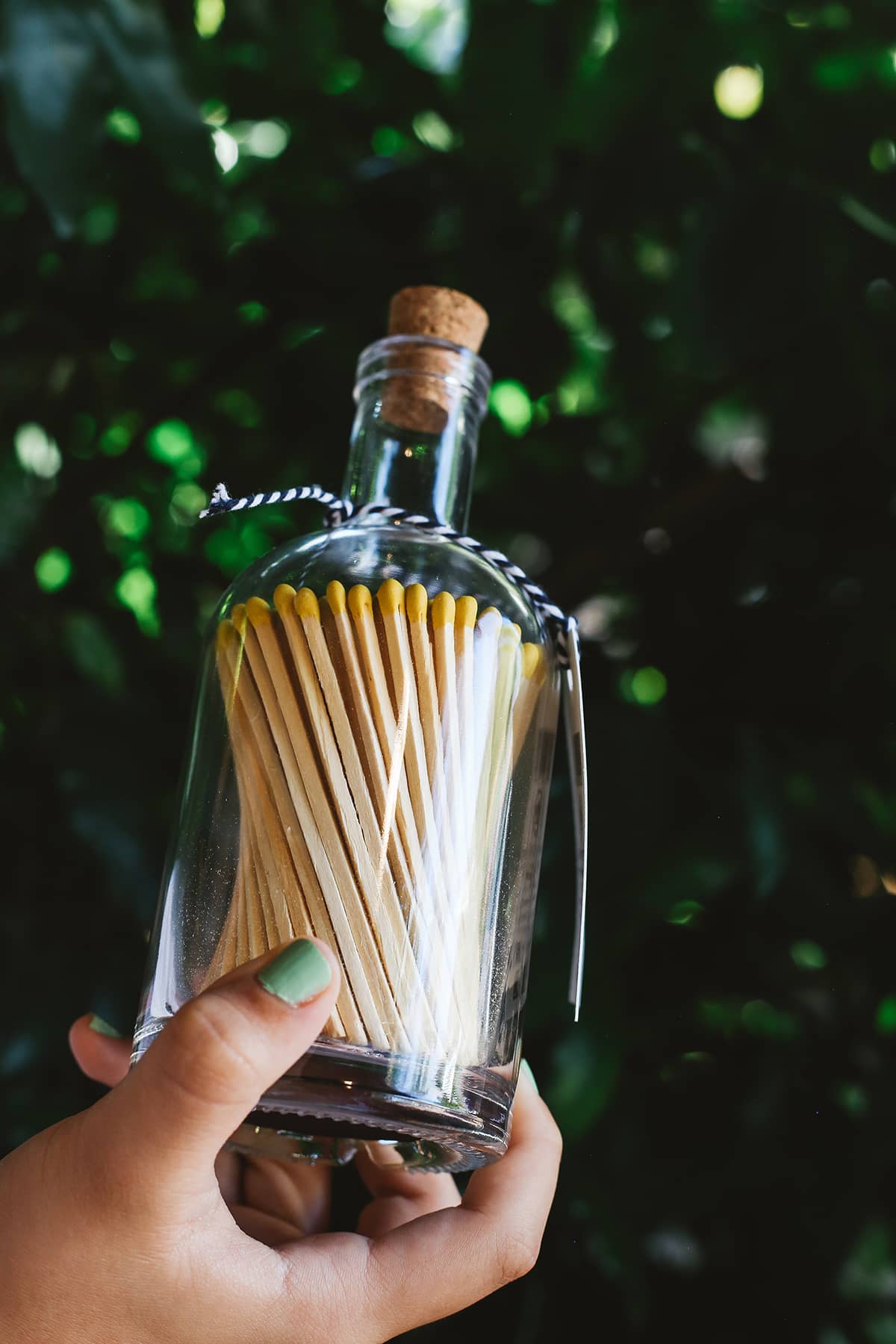 Archivist Match Bottle featuring long orange matches in a corked glass bottle 