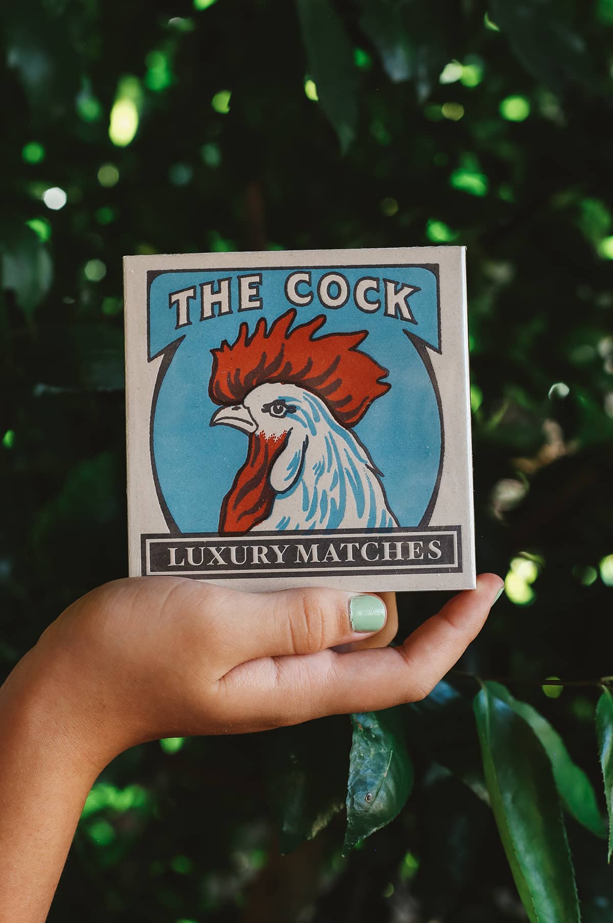 Archivist Luxury Matches with illustrated cock design and graphic text "The Cock Luxury Matches"