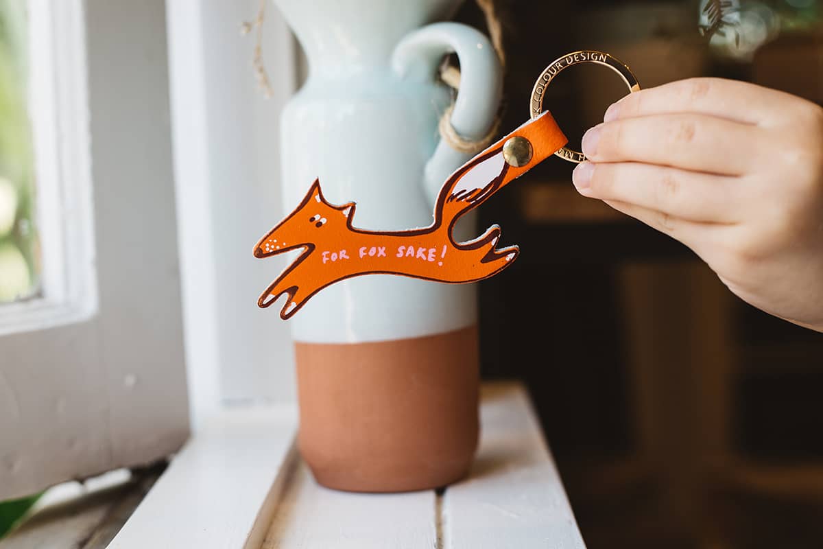 Àine & Co. Ark Colour Design Keyring in "Fox", featuring leather orange fox design and gold hardware, with text "For Fox Sake!"