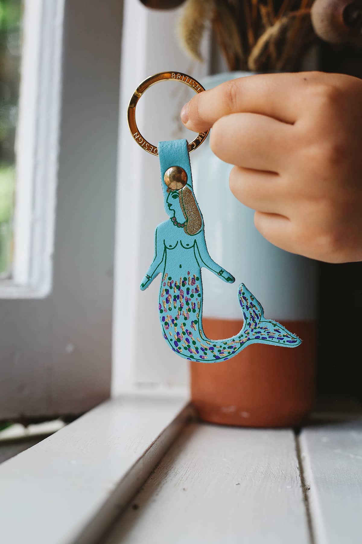 Àine & Co. Ark Colour Design Keyring in "Mermaid", featuring leather with illustrated light blue mermaid design and gold hardware