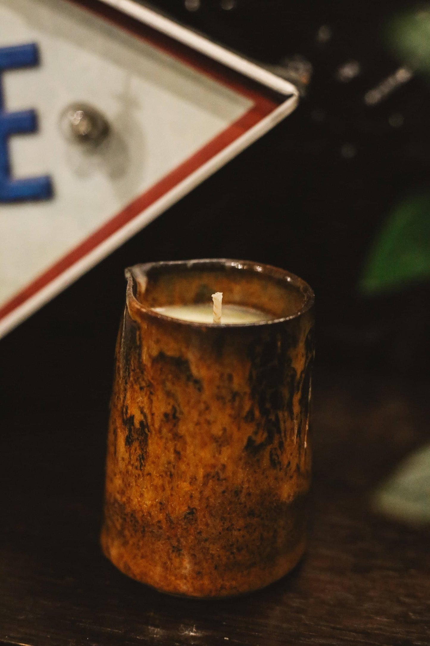 Close up of Àine & Co. body balm candle in a ceramic milk jug