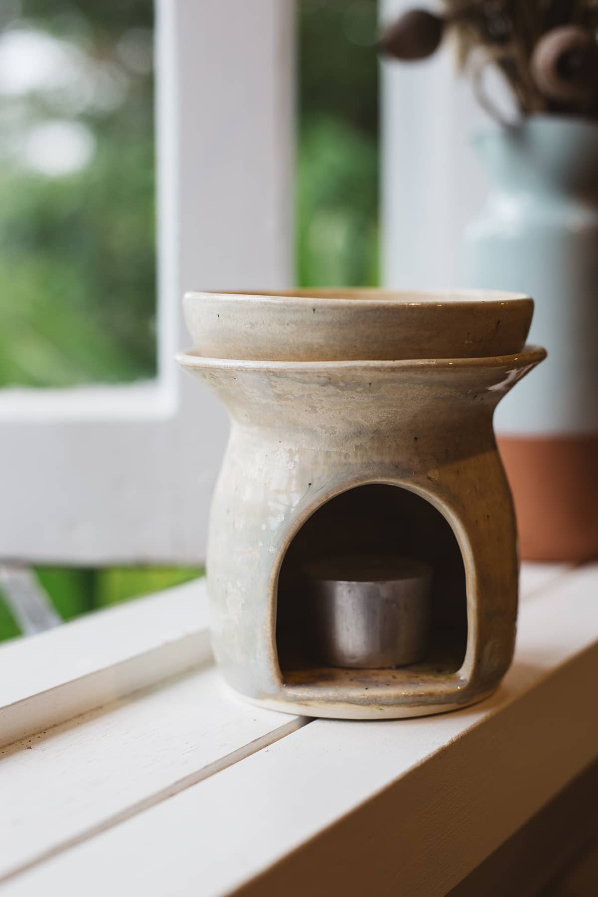 Àine & Co. Clay Temple Tea Light Burner in Natural. Upper section of burner nested in lower one.