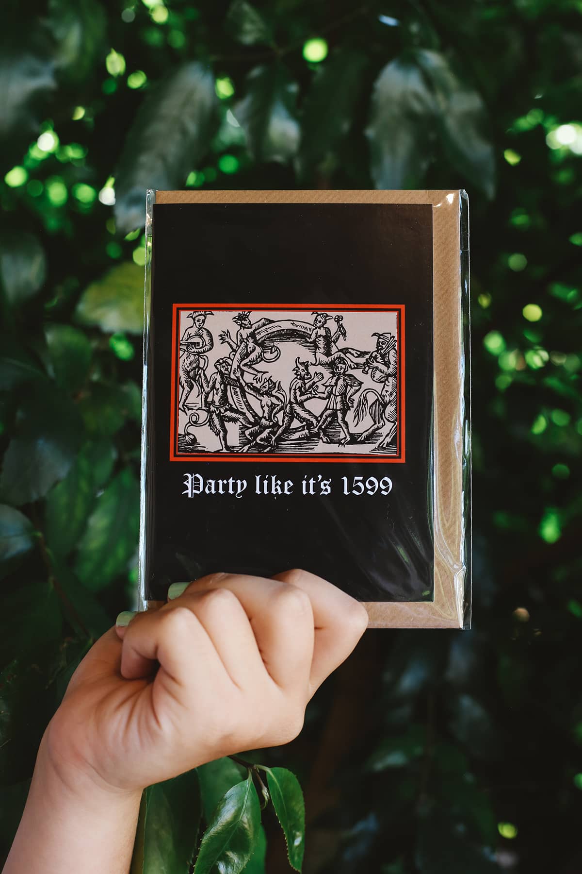 Clavis & Claustra greeting card featuring black background and illustration with graphic text "Party like it's 1599"