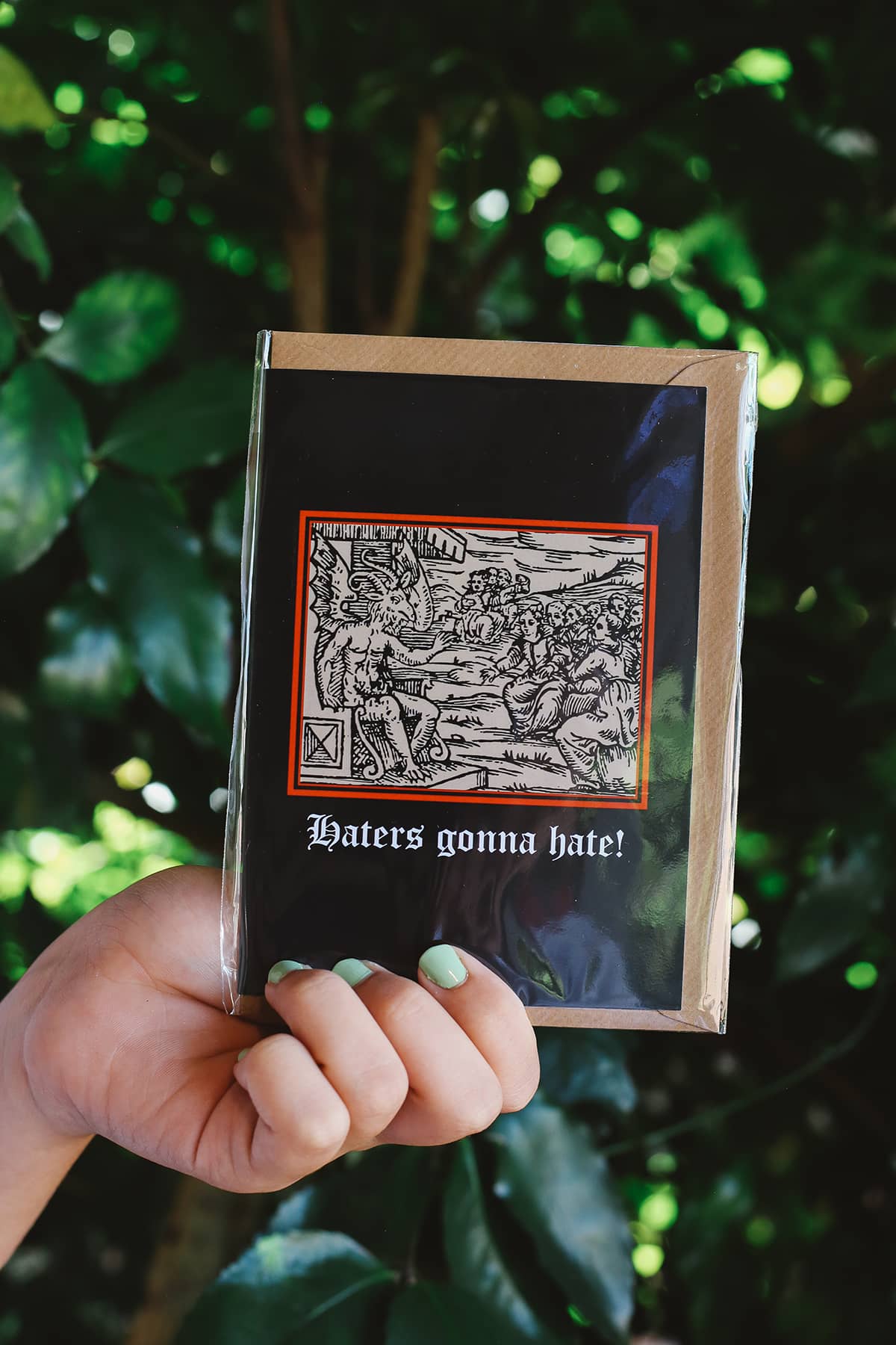 Clavis & Claustra greeting card featuring black background and illustration with graphic text "Haters gonna hate!"