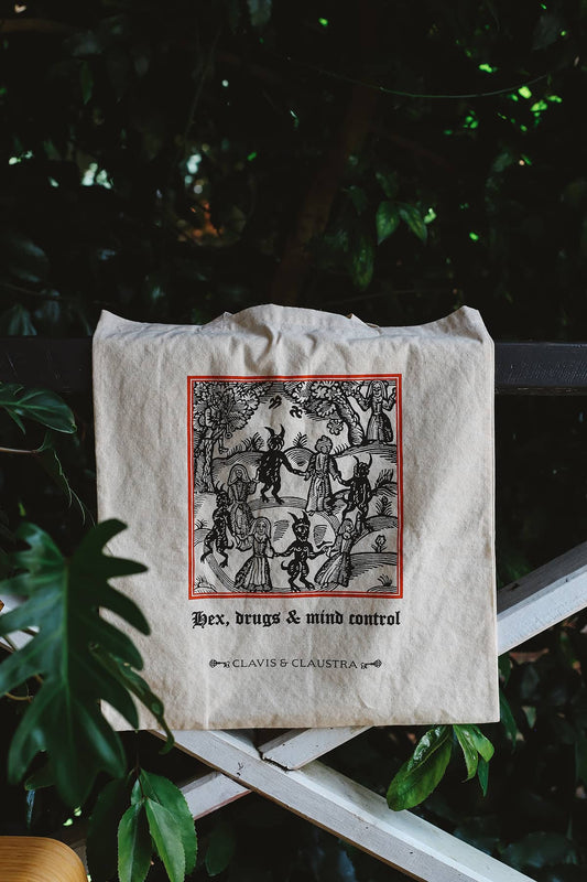 Clavis & Claustra tote bag featuring witchy illustration with graphic text "Hex, drugs and mind control"