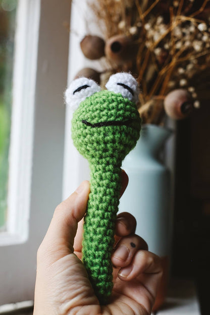 Àine & Co. Crochet Baby Rattle in "Frog", featuring green frog design