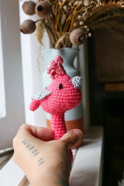 Àine & Co. Crochet Baby Rattle in "Pink Bird", featuring pink bird design