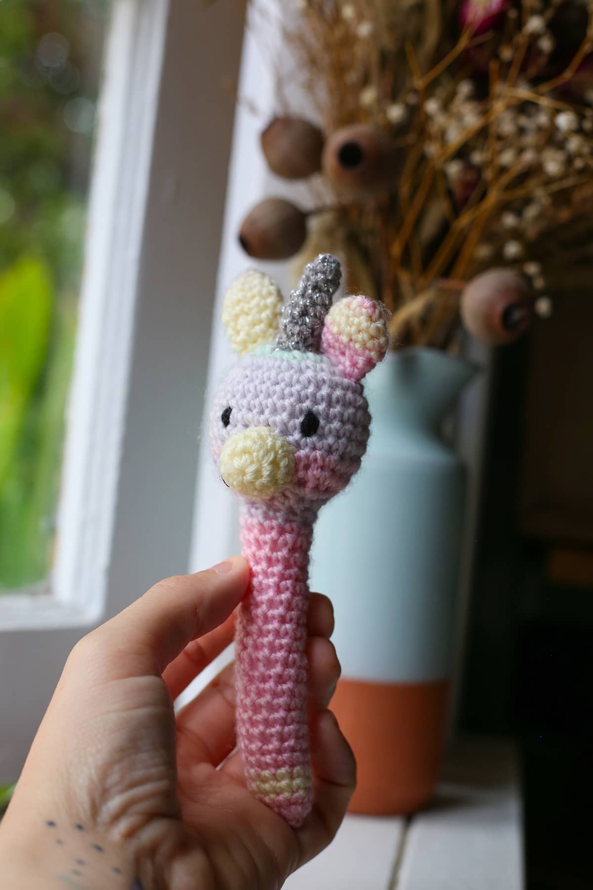 Àine & Co. Crochet Baby Rattle in "Unicorn", featuring pastel unicorn design