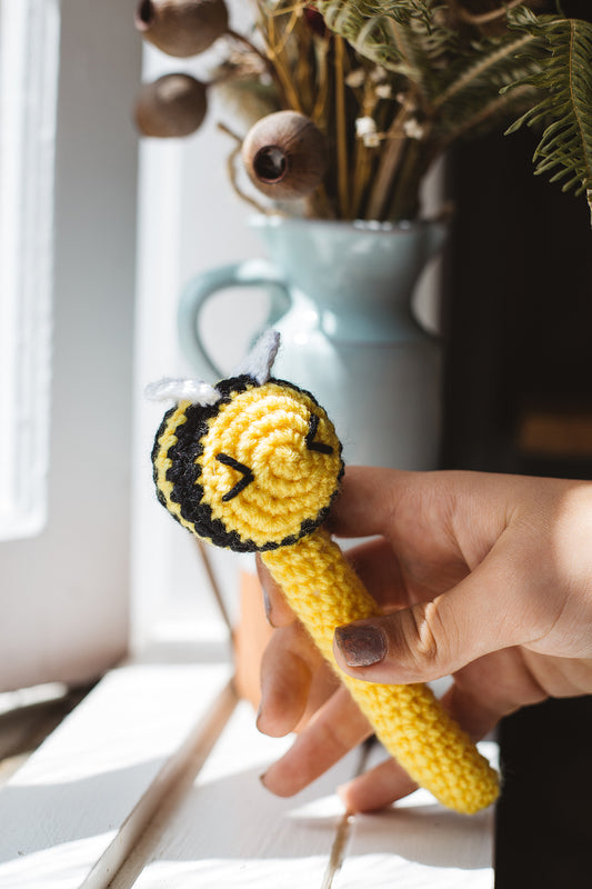 Àine & Co. Crochet Baby Rattle in "Bee", featuring yellow bee design