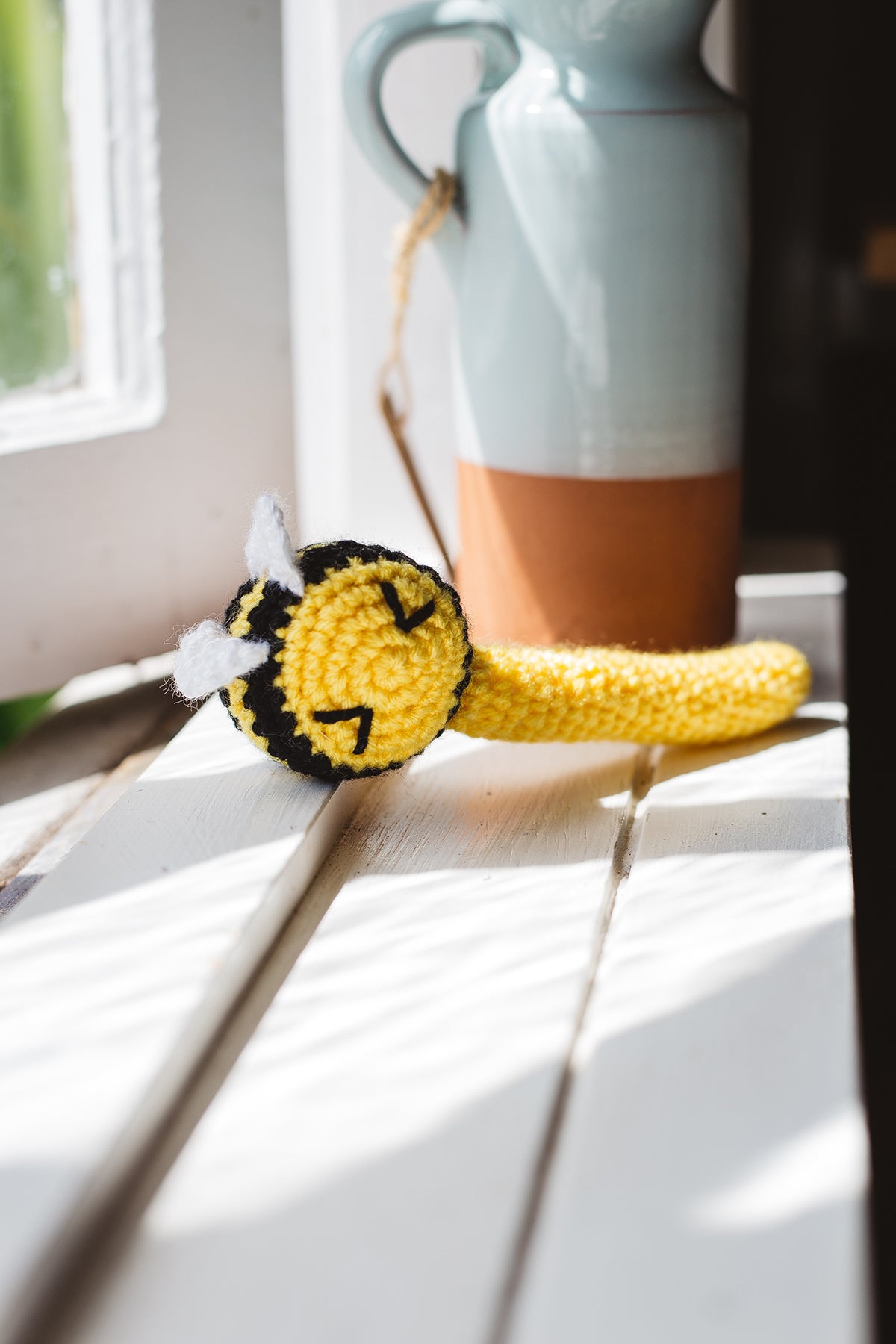 Àine & Co. Crochet Baby Rattle in "Bee", featuring yellow bee design
