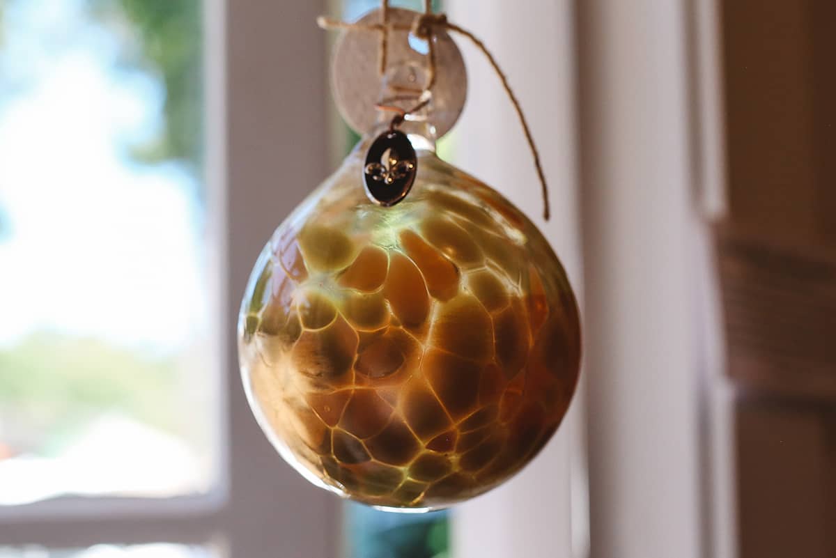 Àine & Co. Faerie Glass Bauble in style "C", featuring orange glass design