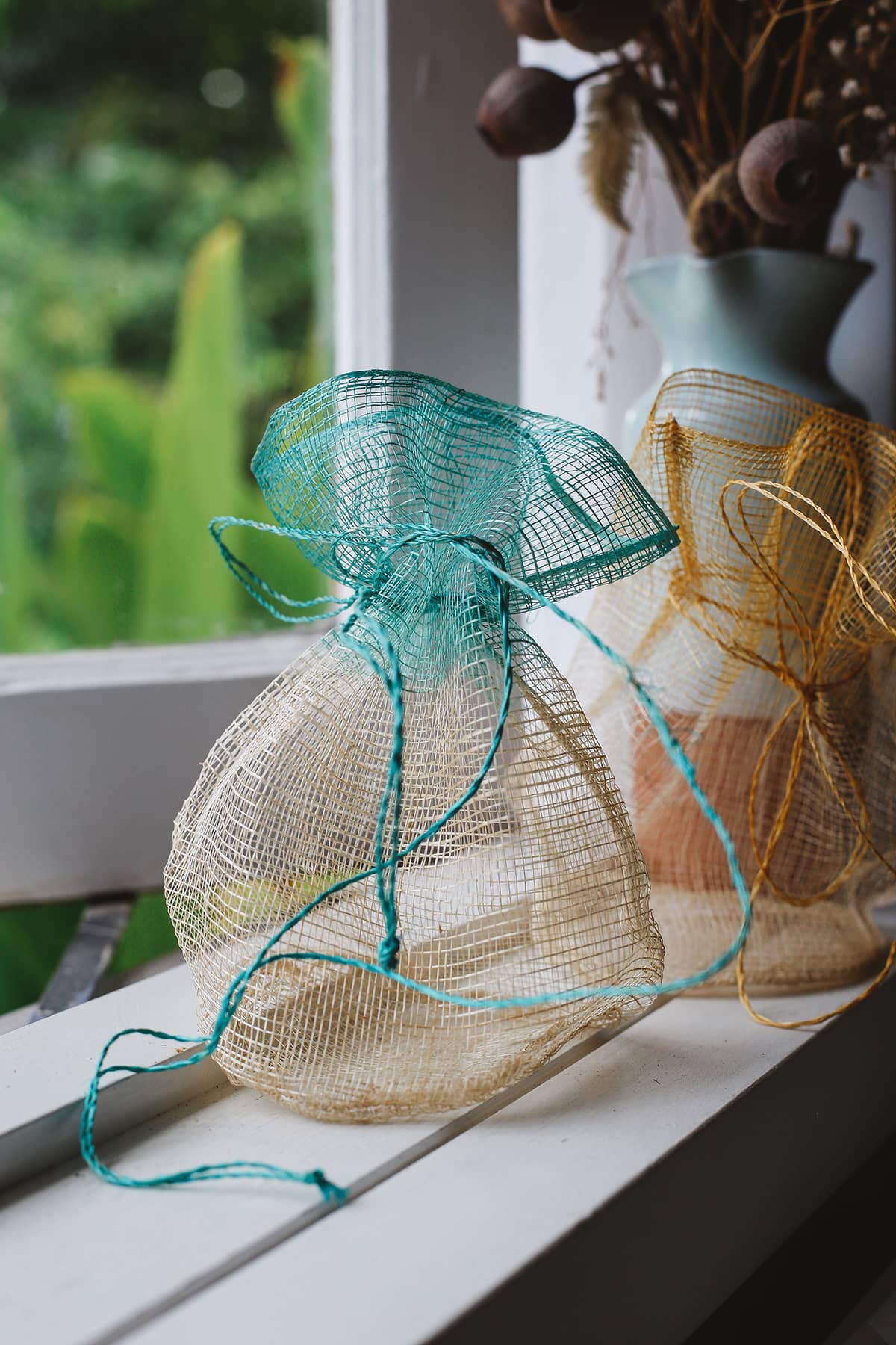 Àine & Co. blue and natural Sinamay mesh gift bag