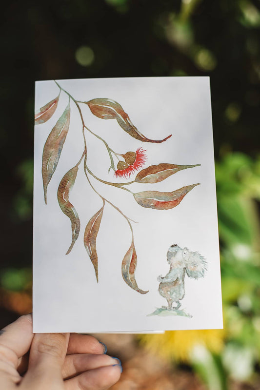 Àine & Co. gift card by Australian Artist, Heather Dale, featuring illustrated koala, gum nuts and leaves