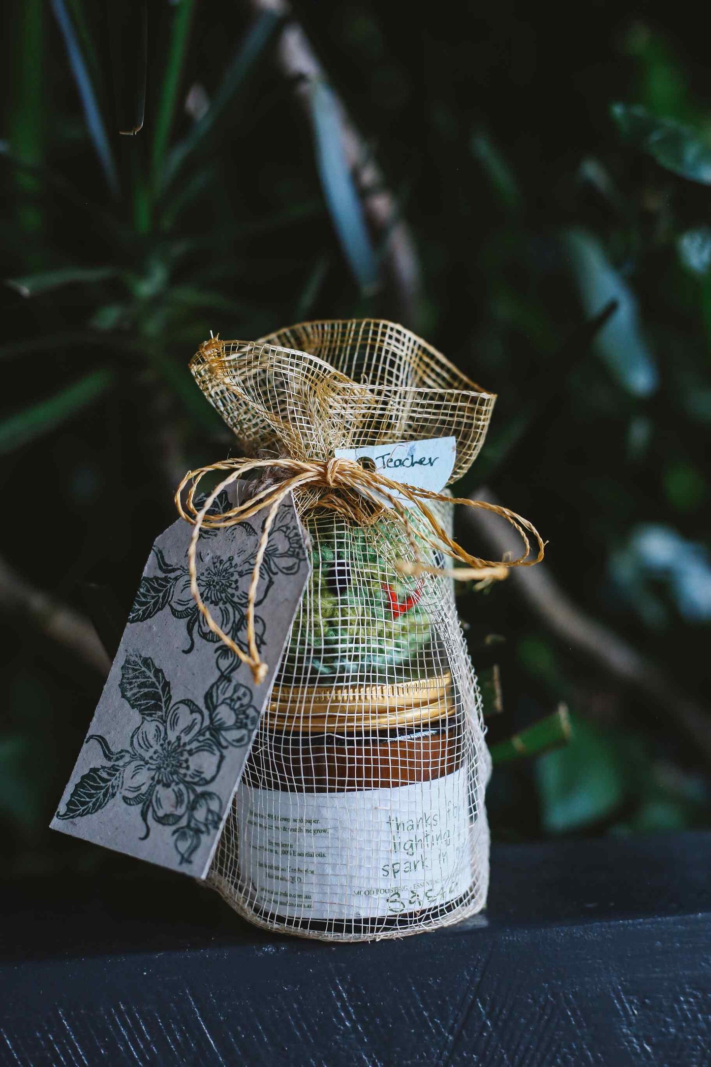 Sinamay bag with artisan candle and crochet apple with gift tag