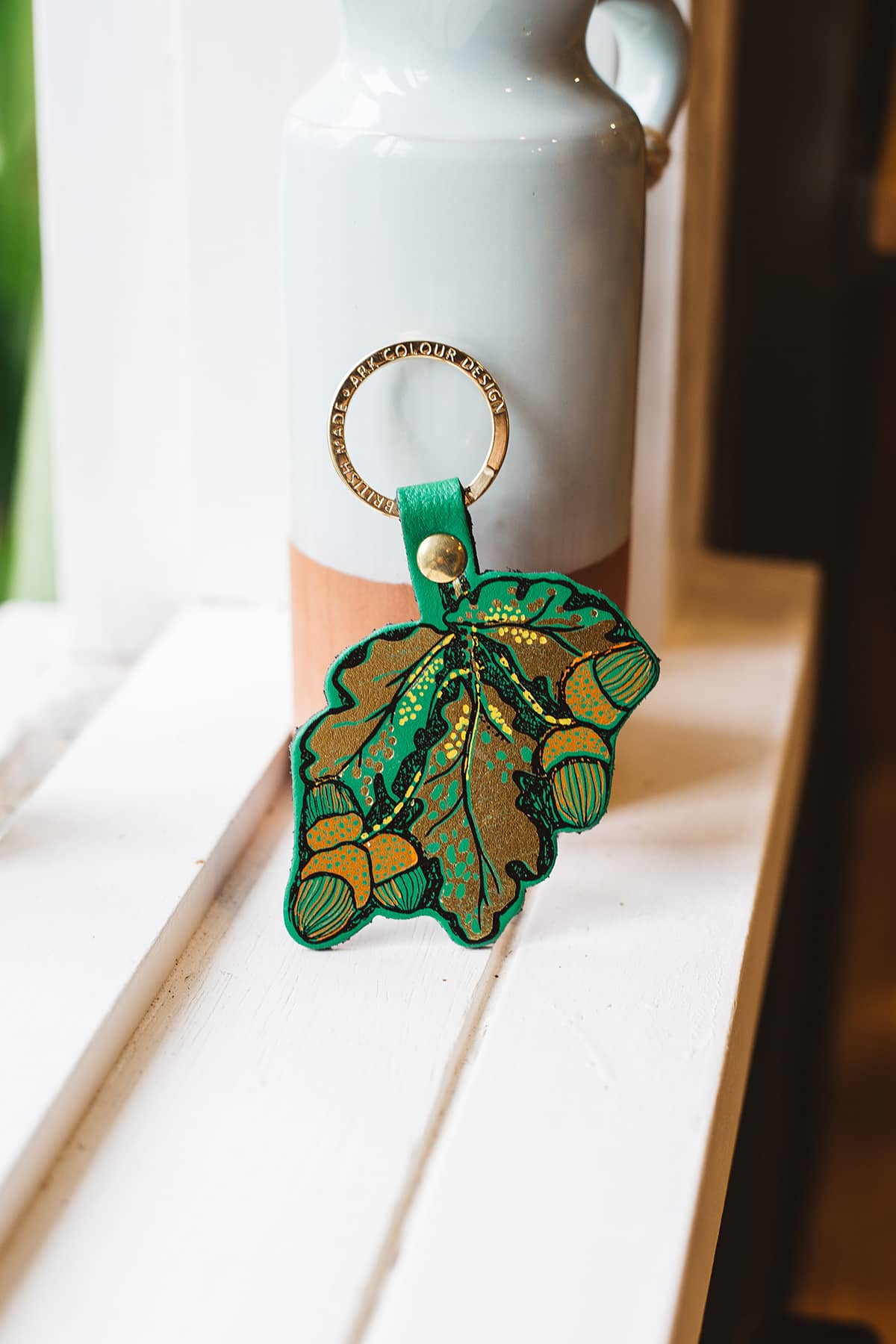 Àine & Co. Ark Colour Design Keyring in "Acorns", featuring leather leaf and acorn design with gold hardware