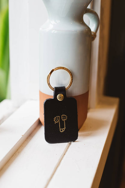 Àine & Co. Ark Colour Design Keyring in "Male (Black)", featuring leather with illustrated penis design and gold hardware