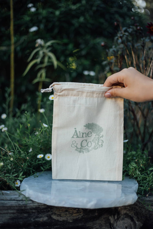 Àine & Co. logo calico drawstring bag