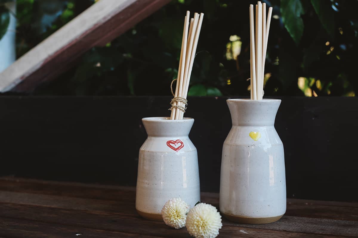 Àine & Co. Love in Bloom Ceramic Reed Diffuser and vase, featuring a painted heart shape.