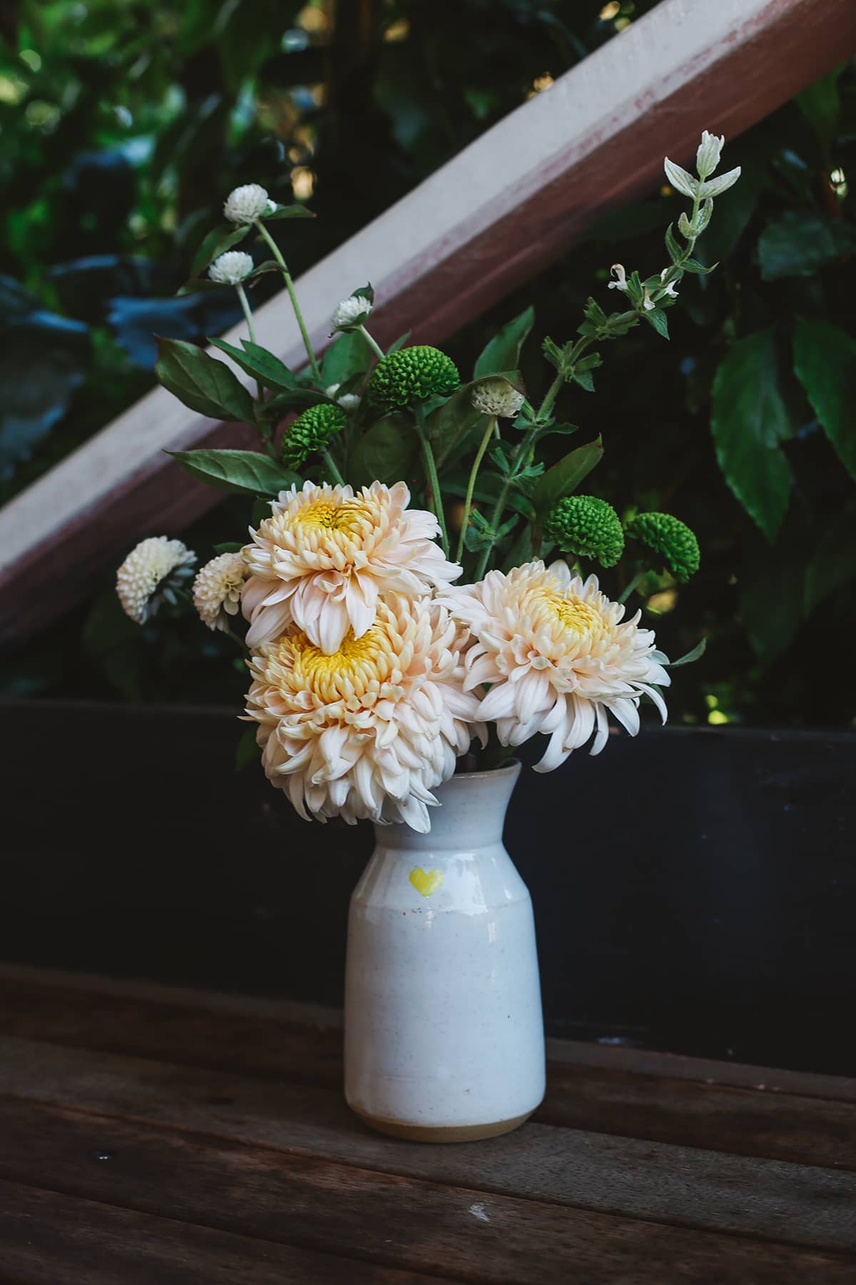 Àine & Co. Love in Bloom Ceramic Reed Diffuser and vase, featuring a painted heart shape, filled with fresh flowers