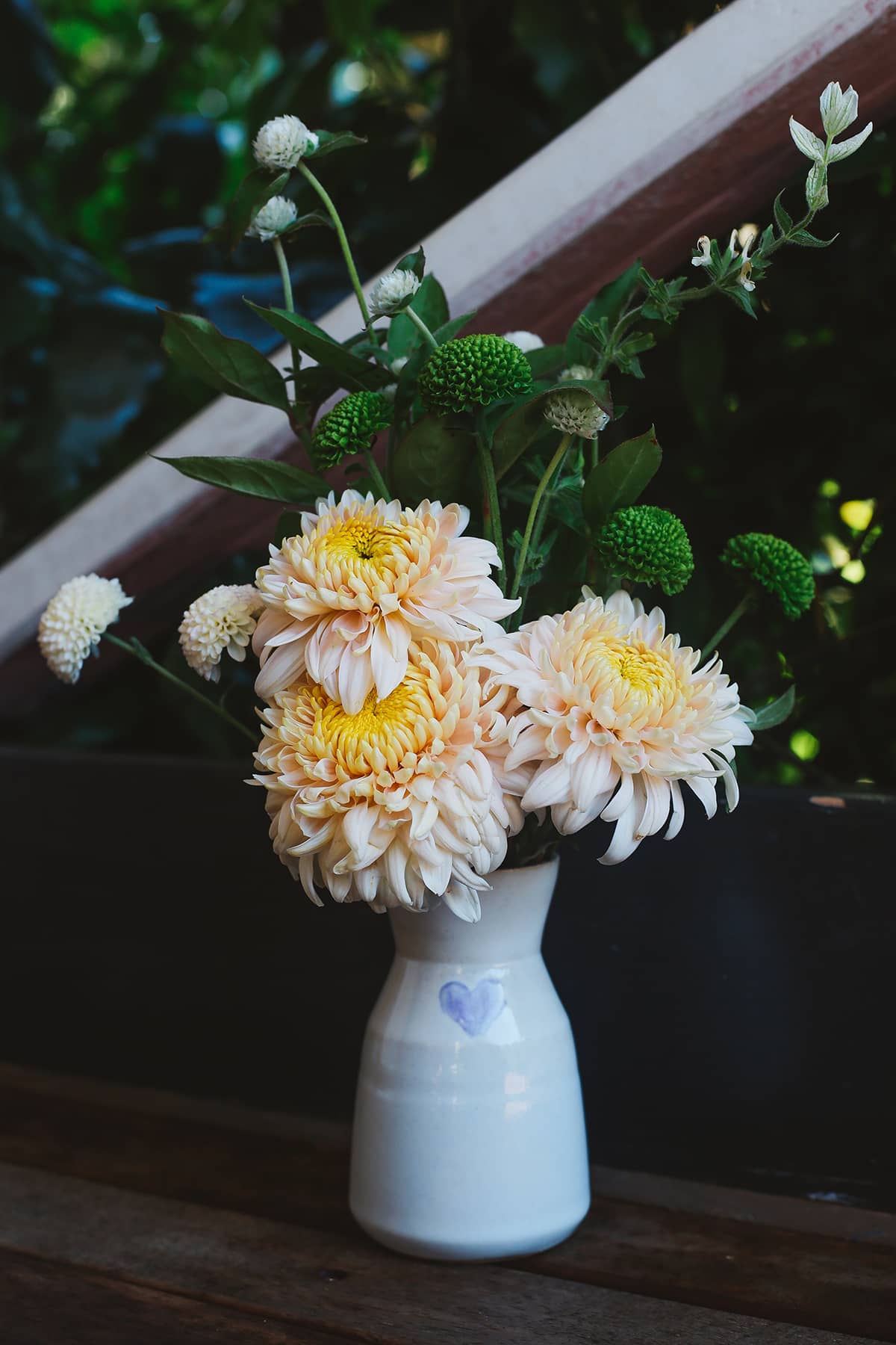 Àine & Co. Love in Bloom Ceramic Reed Diffuser and vase, featuring a painted heart shape, filled with fresh flowers