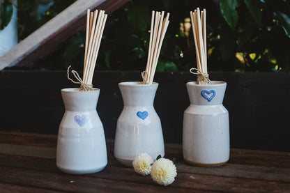 Àine & Co. Love in Bloom Ceramic Reed Diffuser and vase, featuring a painted heart shape.