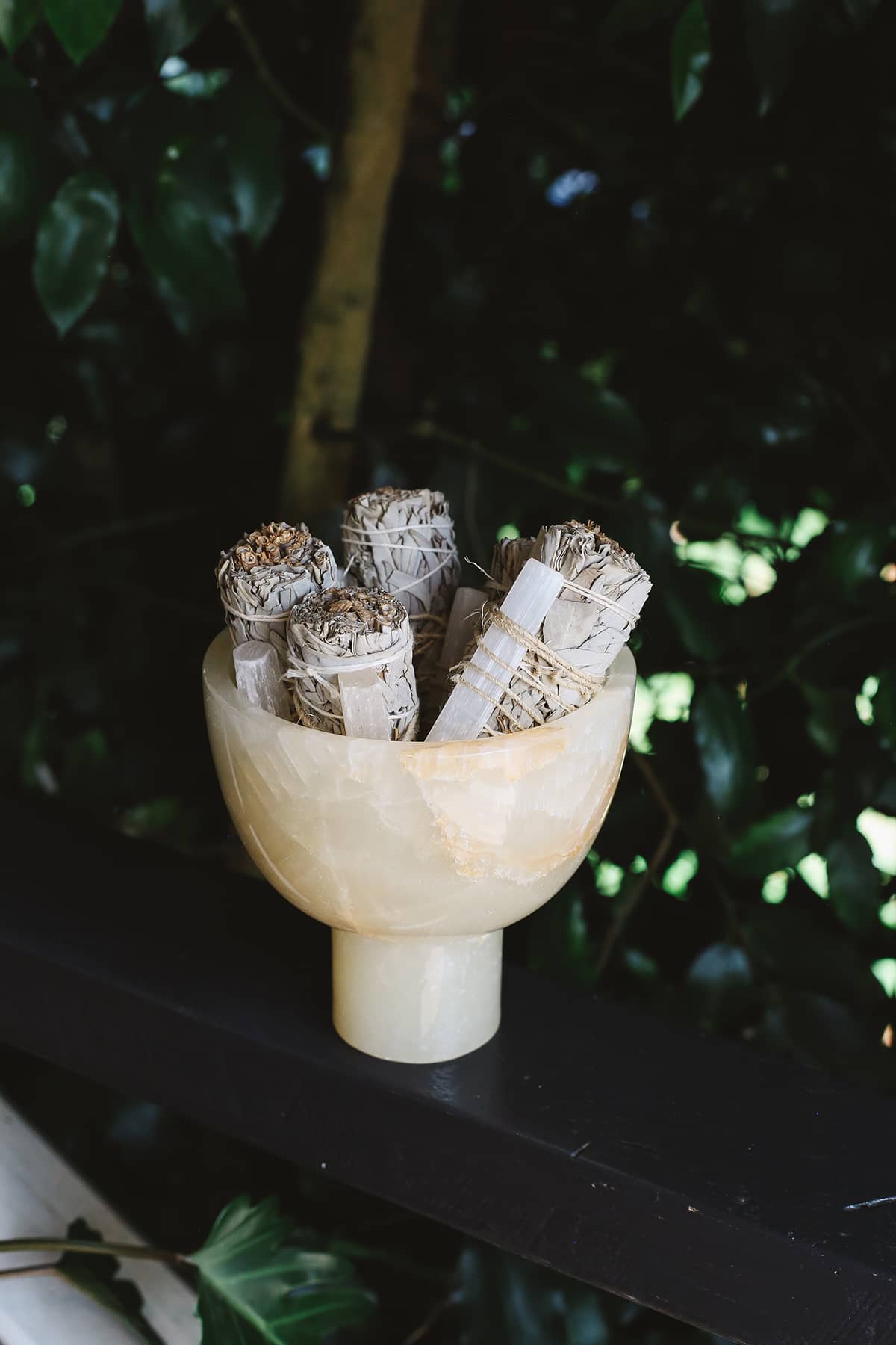Five of Àine & Co.'s Selenite & White Sage Cleansing Sticks in a crystal bowl
