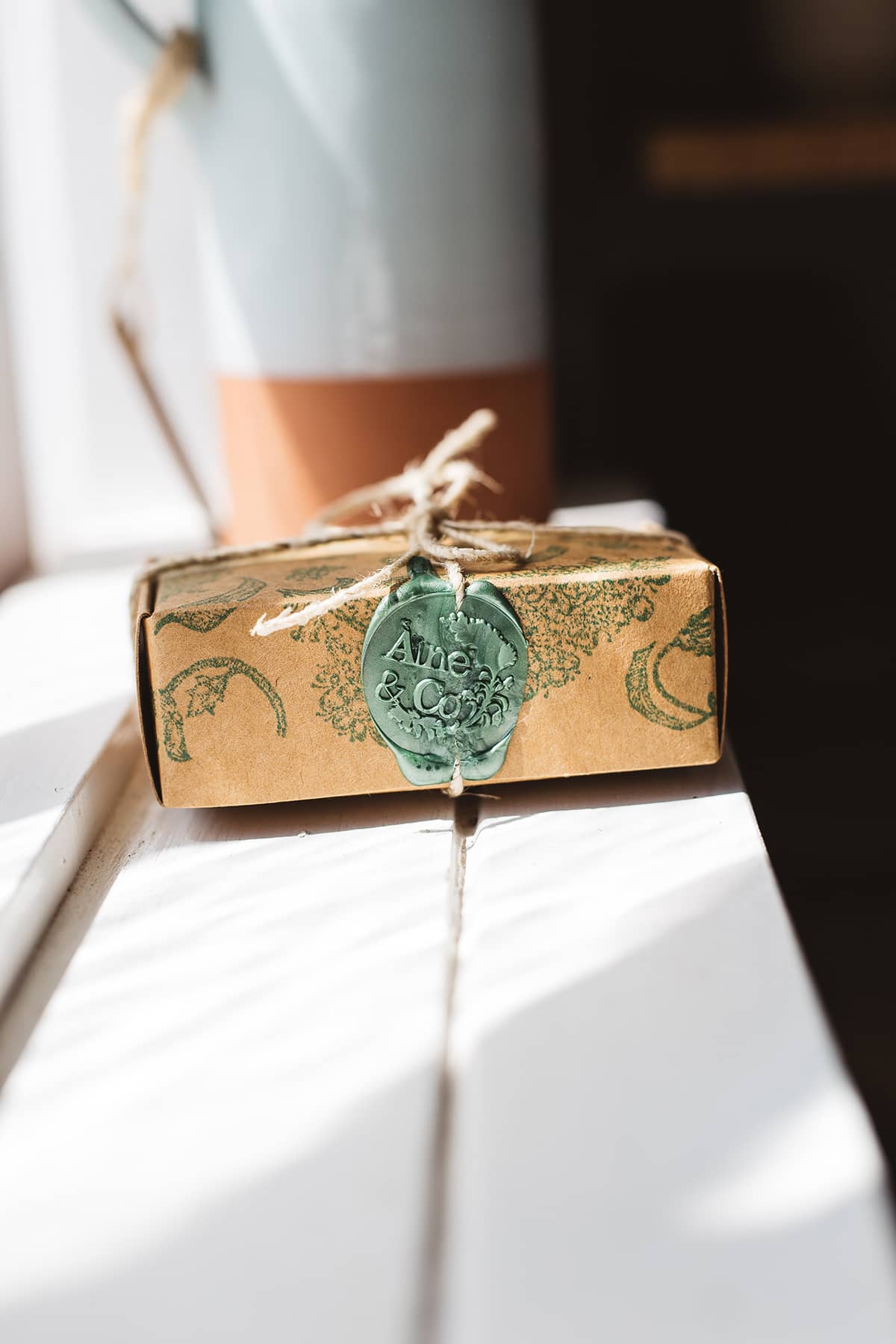 Àine & Co. small wax melt box in Àine, packaged in illustrated paper box, wrapped in string, sealed with sage logo wax seal