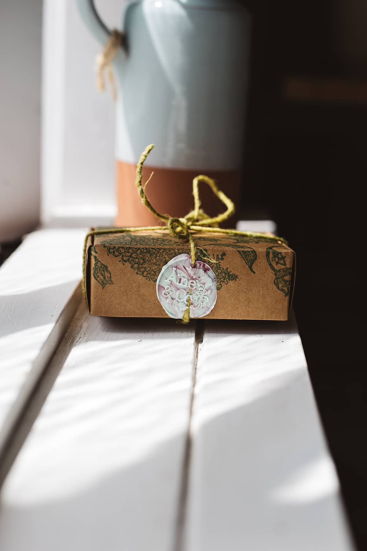 Àine & Co. small wax melt box in Australia, packaged in illustrated paper box, wrapped in string, sealed with white and pink marble logo wax seal