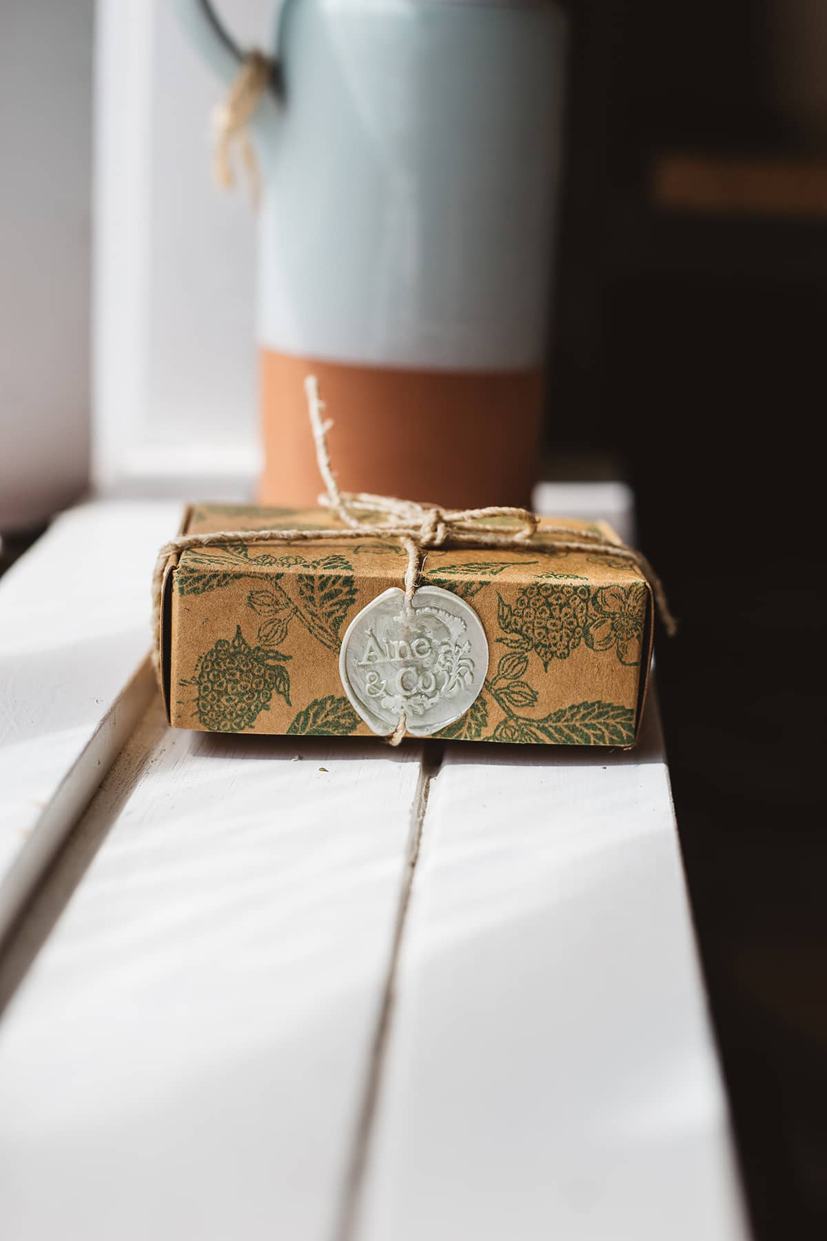 Àine & Co. small wax melt box in Hedge End, packaged in illustrated paper box, wrapped in string, sealed with beige logo wax seal